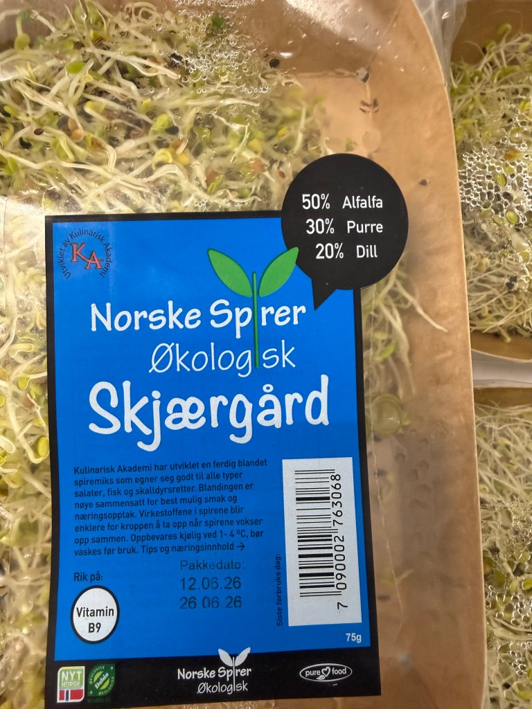 En pakke Norske Spirer Skjærgård i et avlangt pappbeger med plast rundt.